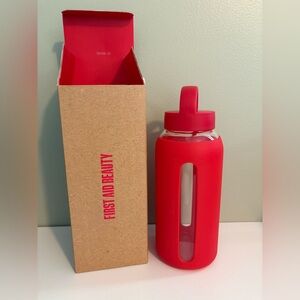 First Aid Beauty Bright Red Glass Water Bottle with Silicone Sleeve and Loop Lid